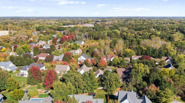 bird's eye view featuring a forest view and a residential view