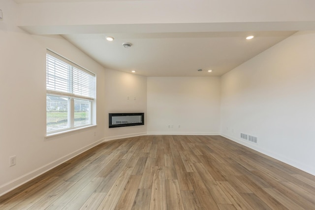 unfurnished living room featuring light hardwood / wood-style floors