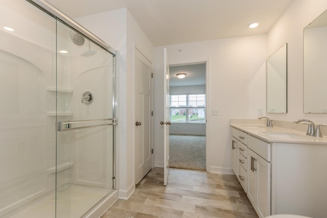 bathroom featuring vanity and walk in shower