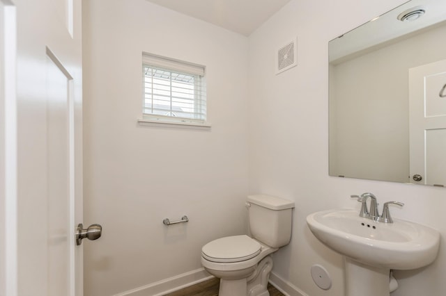 bathroom with sink and toilet