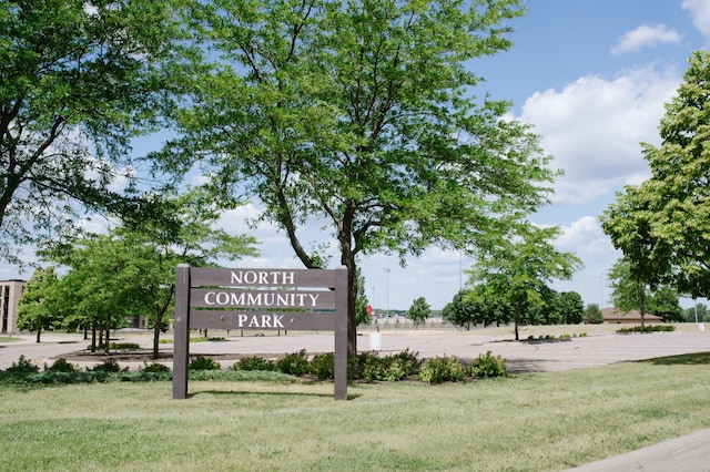 view of home's community with a yard