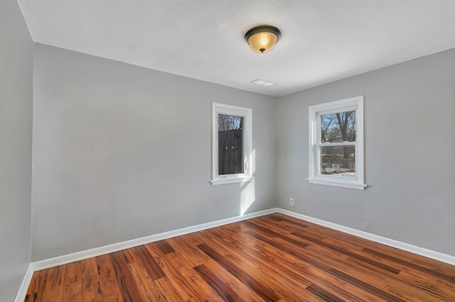 unfurnished room featuring hardwood / wood-style floors