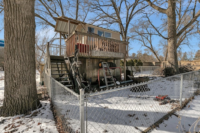 exterior space with stairway, a gate, and a fenced front yard