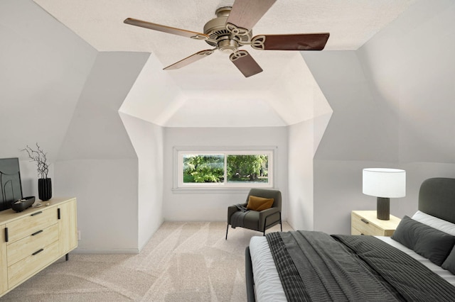 carpeted bedroom with vaulted ceiling and ceiling fan