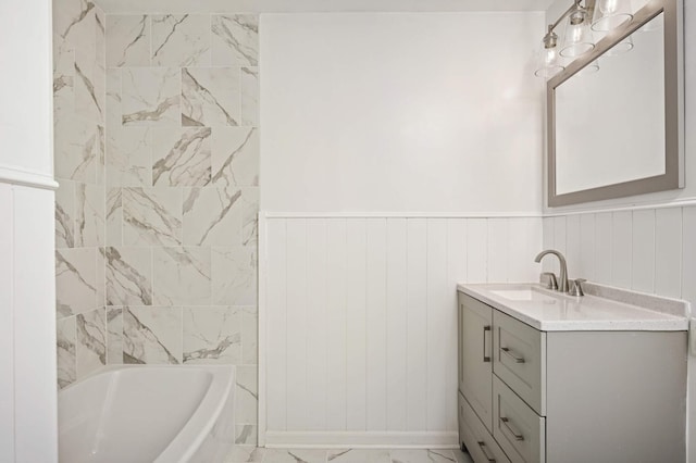 bathroom featuring vanity and a washtub