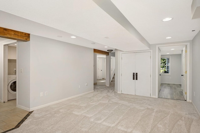 interior space with washer / dryer and light carpet