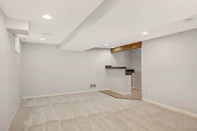 basement with light colored carpet