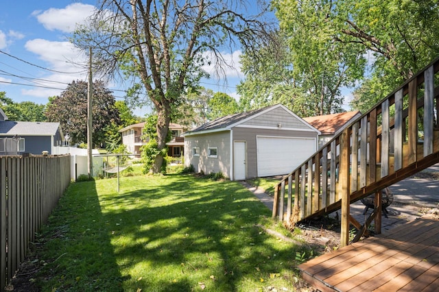 view of yard with an outbuilding and a garage