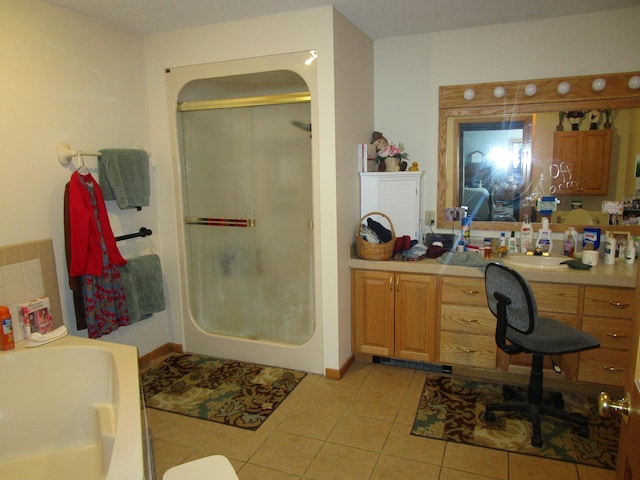 bathroom featuring an enclosed shower, vanity, and tile patterned floors