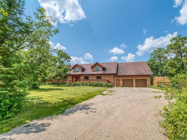 view of front of house featuring a garage, a wooden deck, and a front lawn