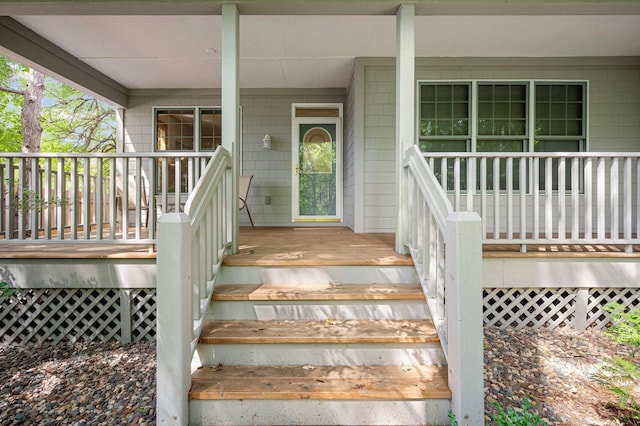 doorway to property featuring covered porch