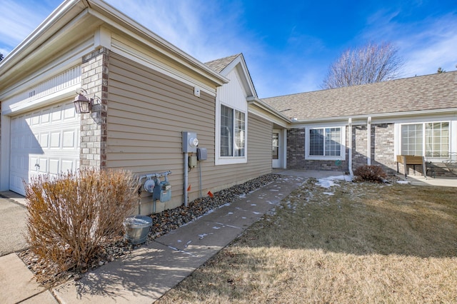 view of side of property featuring a garage