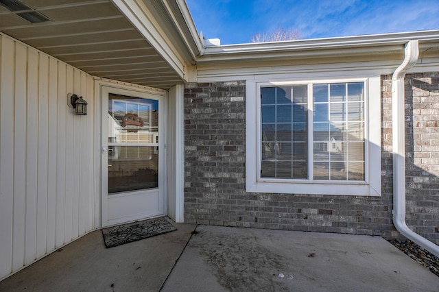 entrance to property featuring a patio