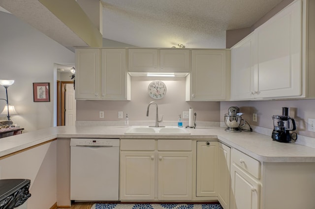 kitchen featuring white dishwasher, sink, a textured ceiling, and white cabinets