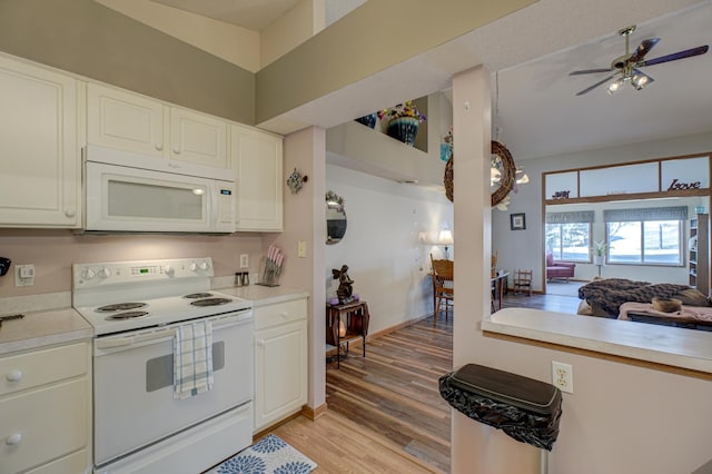 kitchen with ceiling fan, white appliances, light hardwood / wood-style flooring, and white cabinets