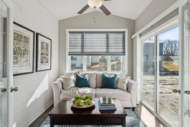 sunroom featuring lofted ceiling, a healthy amount of sunlight, ceiling fan, and french doors