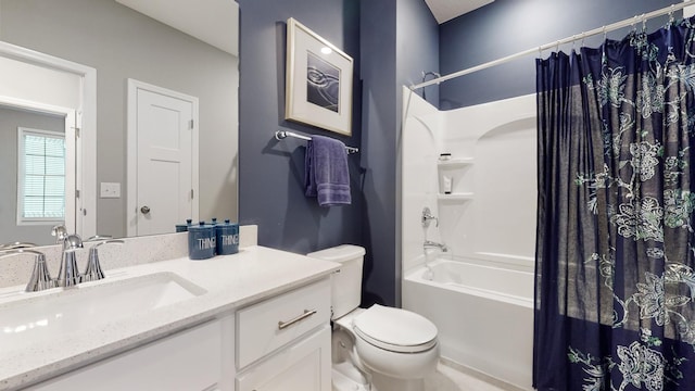 full bathroom featuring vanity, shower / bathtub combination with curtain, and toilet