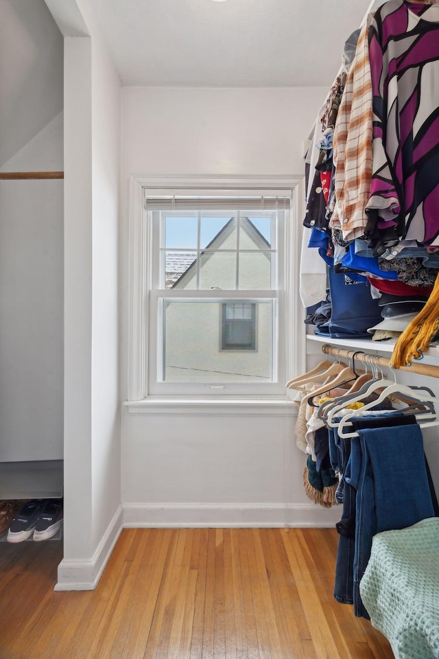 spacious closet with light hardwood / wood-style floors