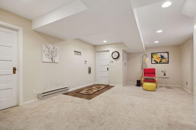 foyer entrance featuring a baseboard radiator and carpet flooring