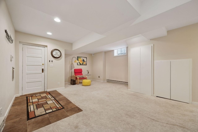 interior space featuring carpet floors and a baseboard heating unit