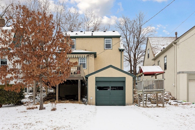 exterior space with a wooden deck and a garage