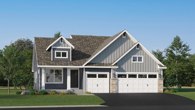 view of front of house featuring a garage and a front lawn