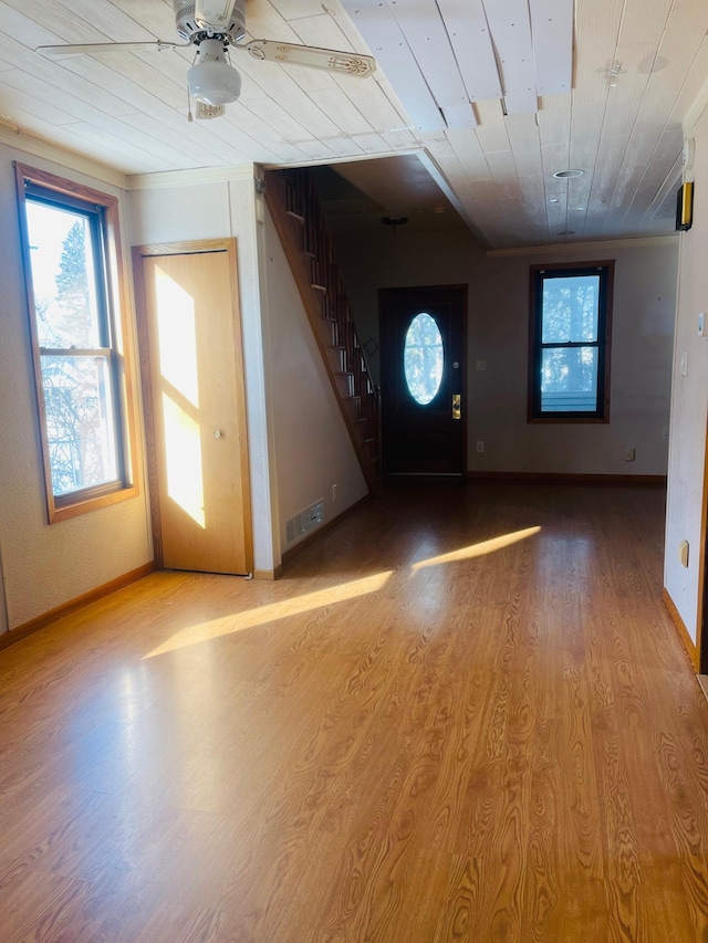 entrance foyer with wood ceiling, ceiling fan, and light wood-type flooring