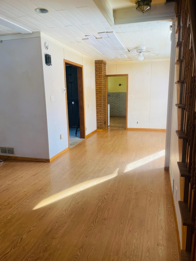 empty room featuring hardwood / wood-style flooring and ceiling fan