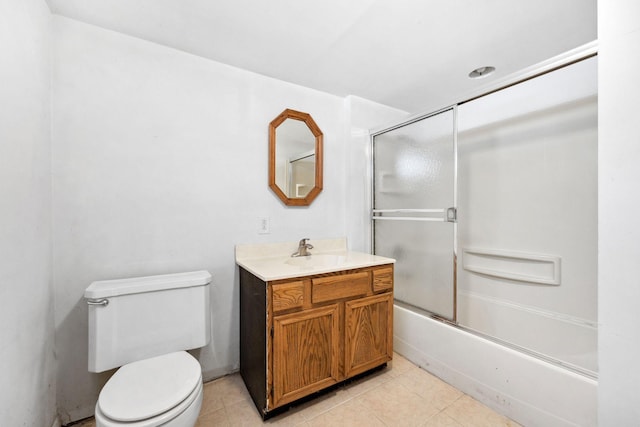 full bathroom featuring tile patterned flooring, enclosed tub / shower combo, vanity, and toilet