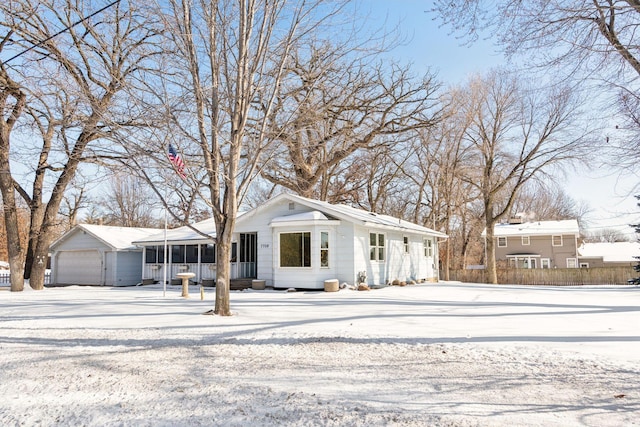 view of front of property with a detached garage