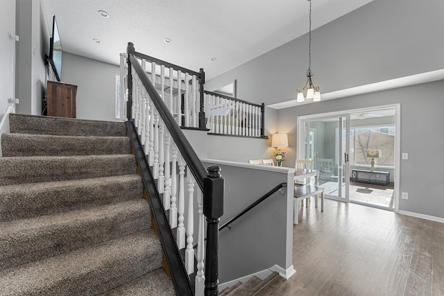 stairs with hardwood / wood-style floors