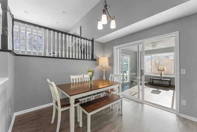 dining area with french doors, wood-type flooring, and a chandelier