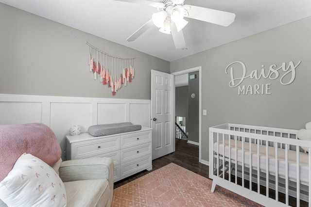 bedroom featuring dark wood-type flooring and ceiling fan