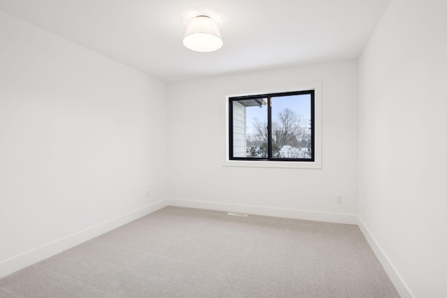 unfurnished room featuring carpet