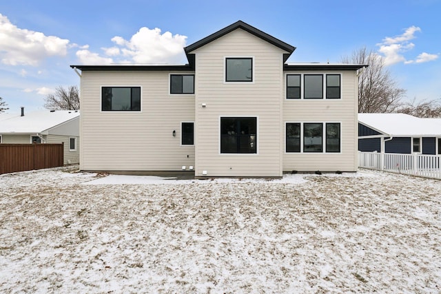 view of snow covered house