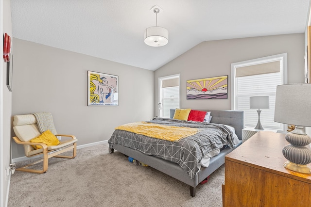 bedroom featuring carpet and lofted ceiling