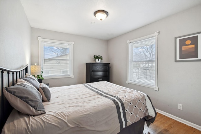 bedroom with hardwood / wood-style floors