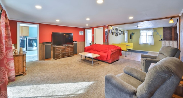 living area with recessed lighting, independent washer and dryer, baseboards, ornamental molding, and carpet floors