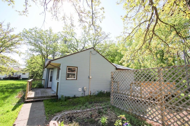 34007 Sunset Loop, Motley, MN 56466 - view of side of home featuring a wooden deck and a lawn
