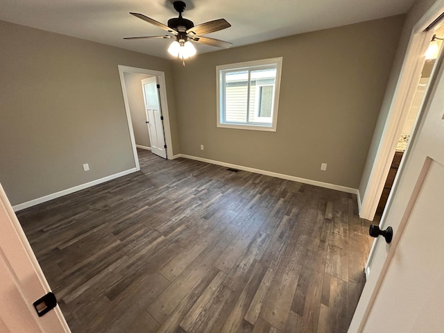 11252 Prairie Village Ln, Becker, MN 55308 - unfurnished bedroom featuring dark hardwood / wood-style floors and ceiling fan