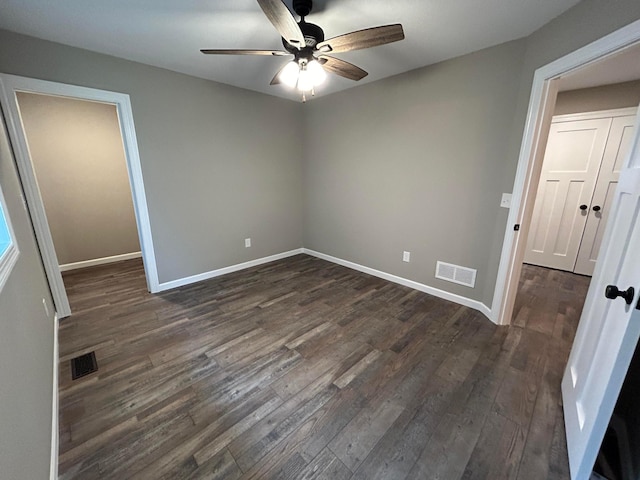 11252 Prairie Village Ln, Becker, MN 55308 - unfurnished bedroom with dark wood-type flooring and ceiling fan