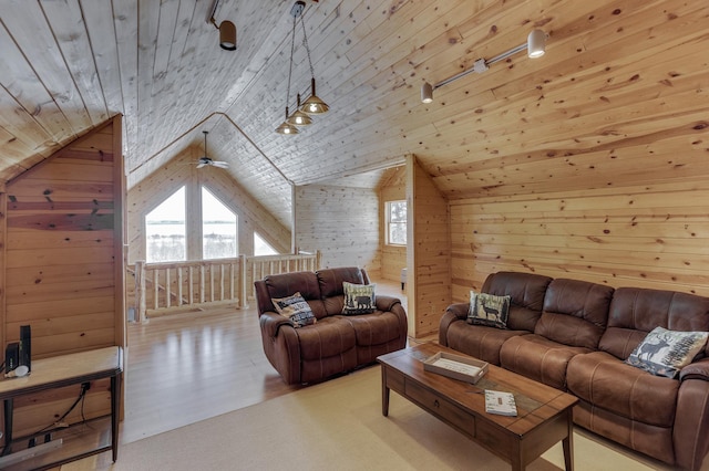 living room featuring vaulted ceiling, wooden ceiling, wooden walls, and light hardwood / wood-style flooring