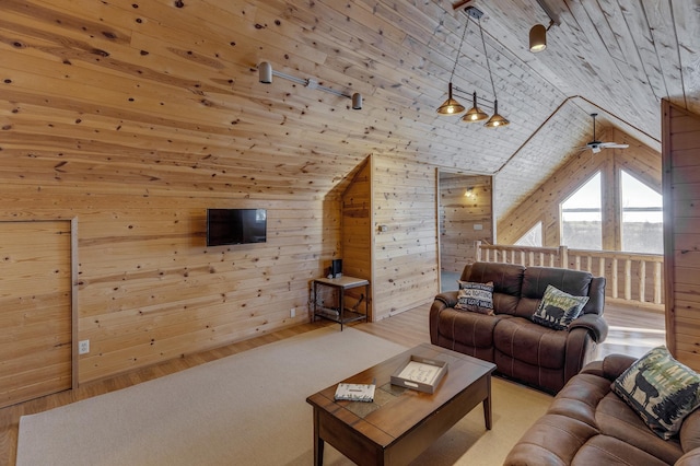 living room featuring wooden walls, wooden ceiling, and vaulted ceiling