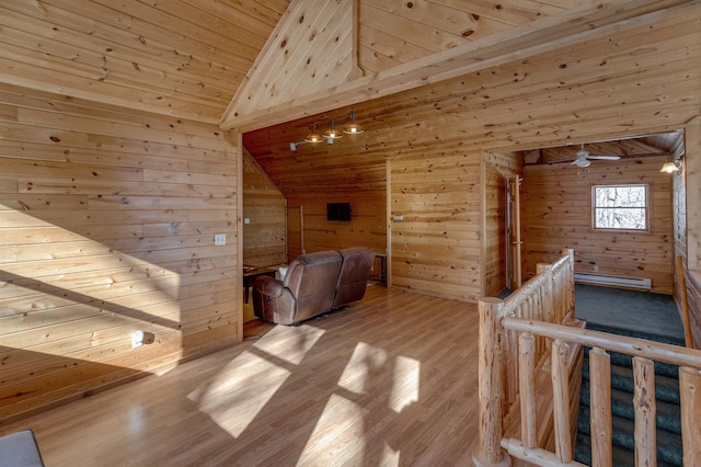 bonus room featuring vaulted ceiling, light wood-type flooring, wood ceiling, and wood walls