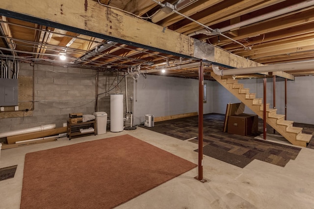 basement featuring gas water heater and electric panel