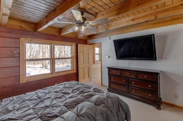 carpeted bedroom featuring wood ceiling, beam ceiling, and ceiling fan