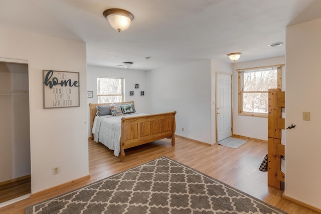 bedroom with light hardwood / wood-style floors