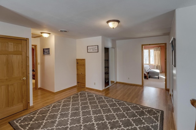 spare room featuring hardwood / wood-style floors