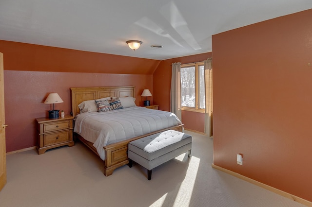 carpeted bedroom with vaulted ceiling