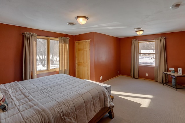 bedroom with light colored carpet